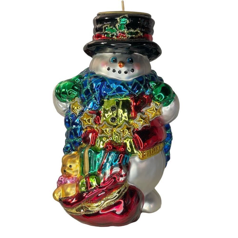 Charming hand-blown mercury glass snowman candle holder.